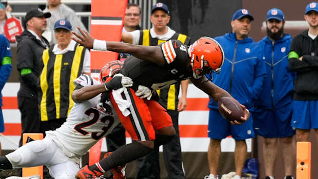 Cleveland Browns quarterback Deshaun Watson (4) stretches to break the plane for a touchdown in the second quarter of the NFL Week 1 game between the Cleveland Browns and the Cincinnati Bengals at FirstEnergy Stadium in downtown Cleveland on Sunday, Sept. 10, 2023. The Browns led 10-0 at halftime.